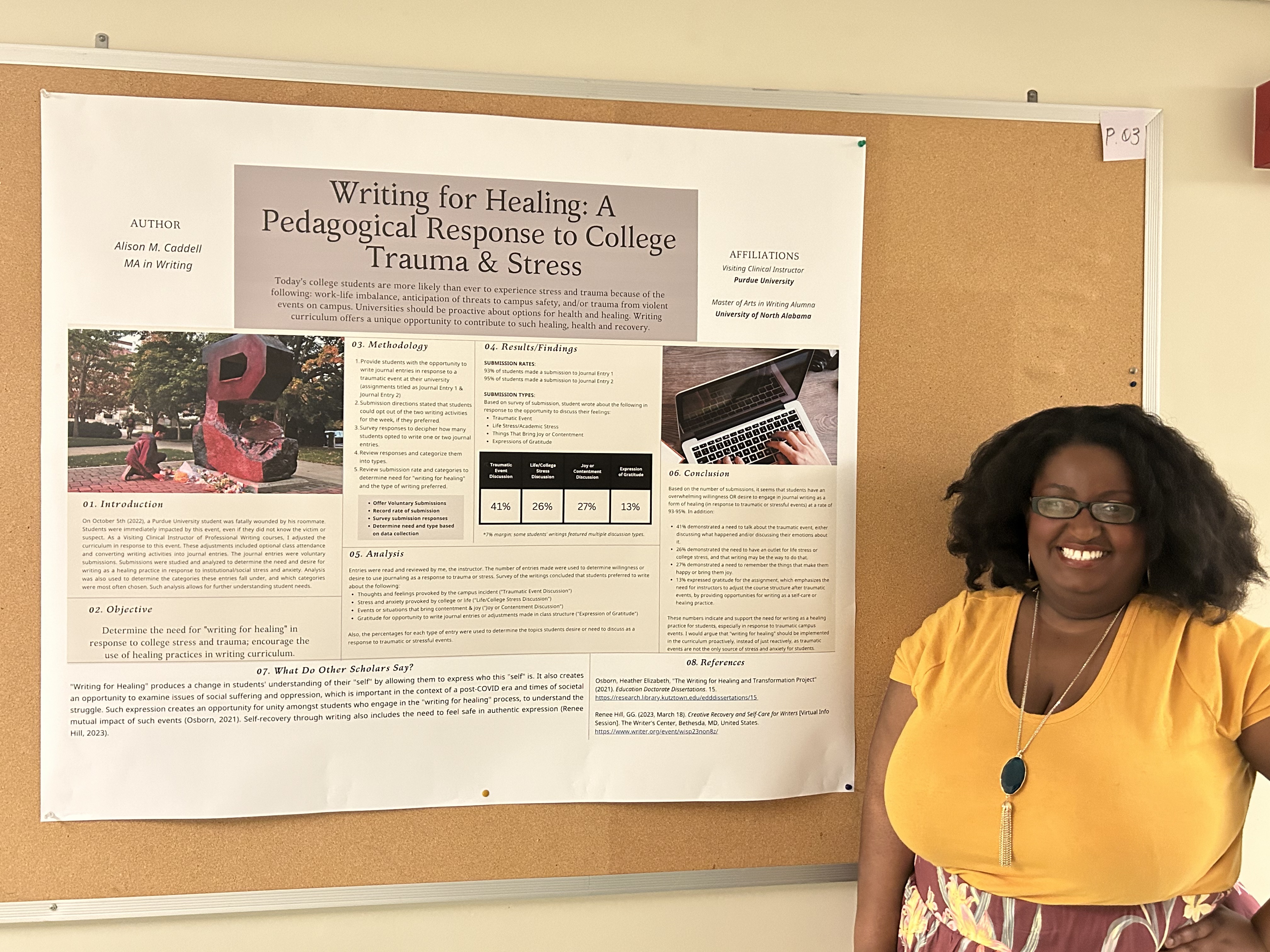 Alison stands next to her research poster.