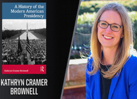 Professor Katie Brownell with her book The History of the Modern American Presidency