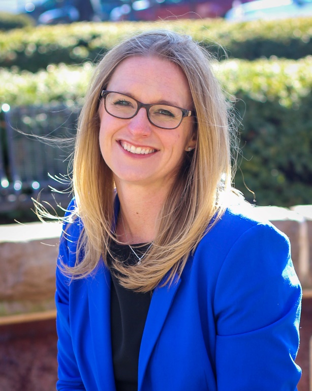 Professional portrait of Kathryn Cramer Brownell outside of University Hall at Purdue University