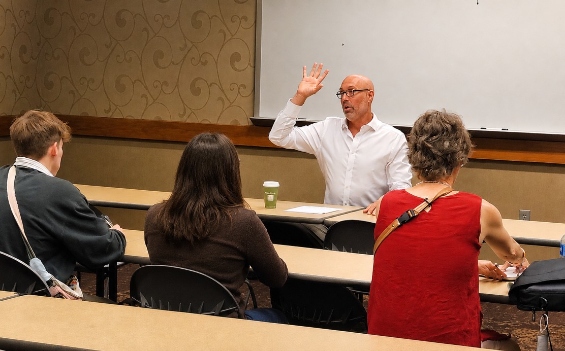 Professor giving a presentation to his class.