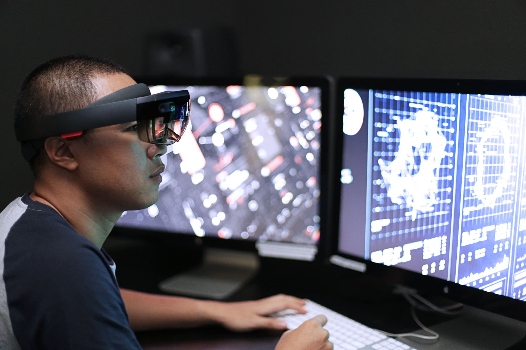 Man playing virtual reality with Microsoft HoloLens.