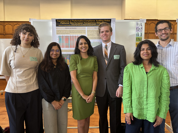 Students standing in front of their research