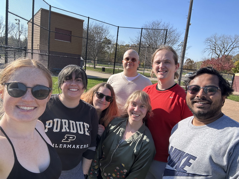 Grad students enjoying a game of kickball
