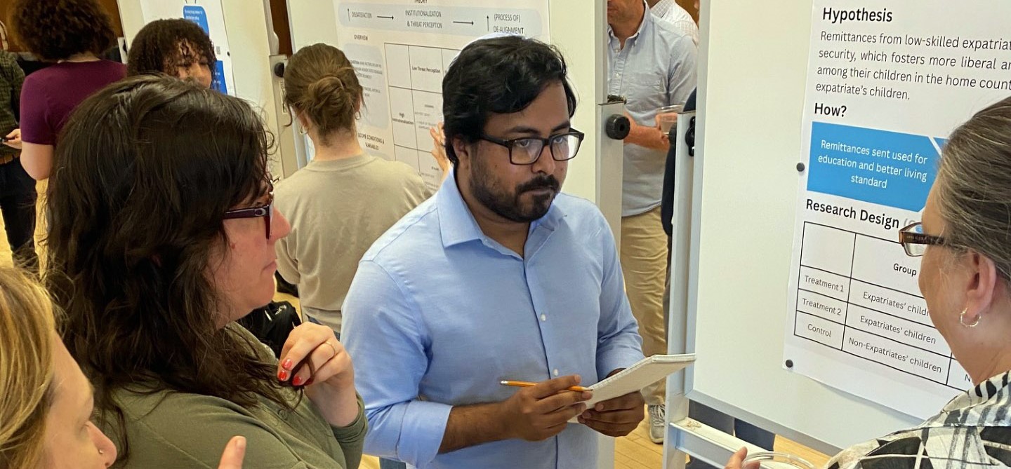 Graduate students discussing research.