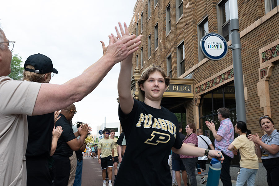 Purdue student high-fiving another