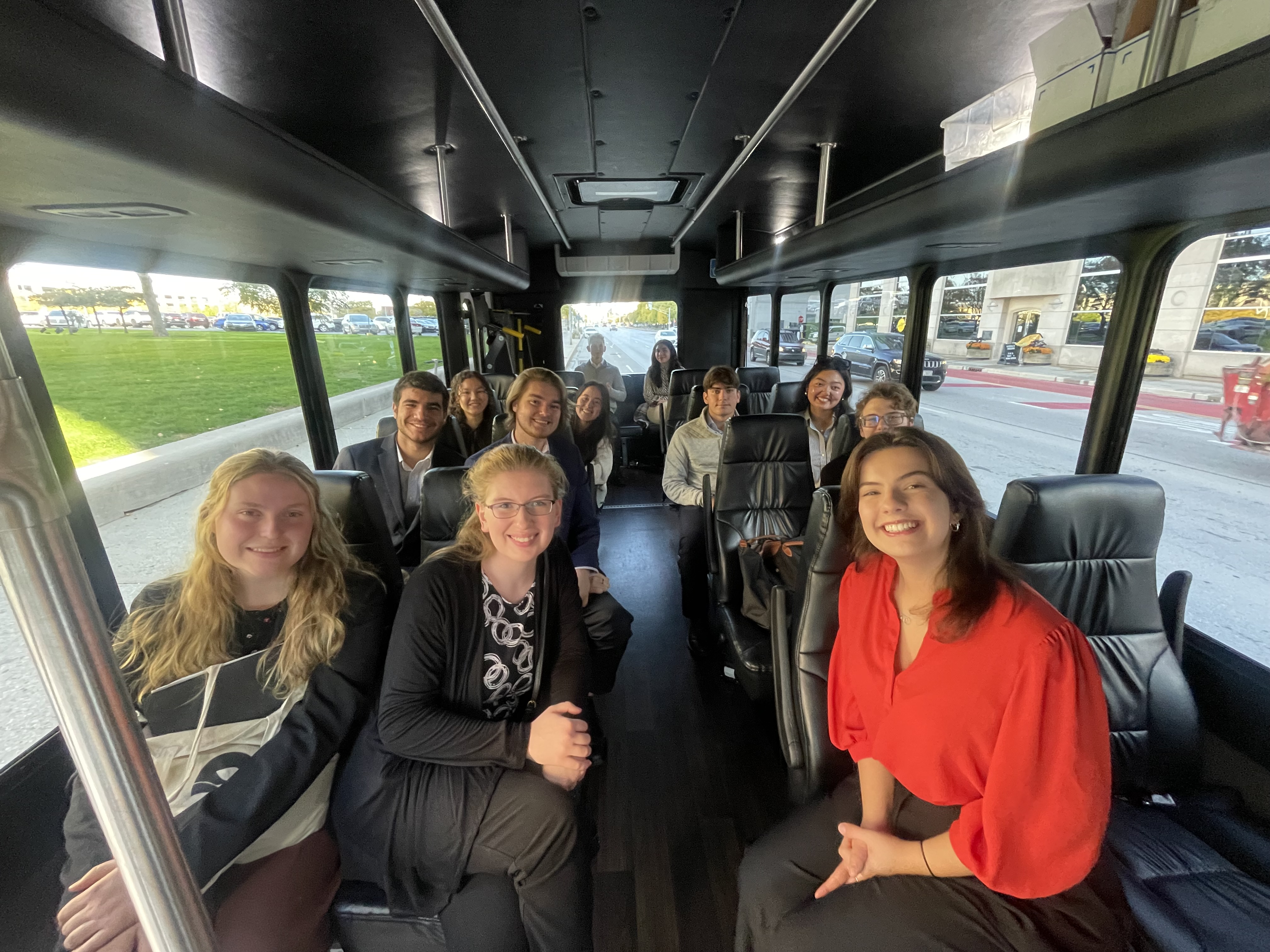 Group of undergraduate students on a bus.