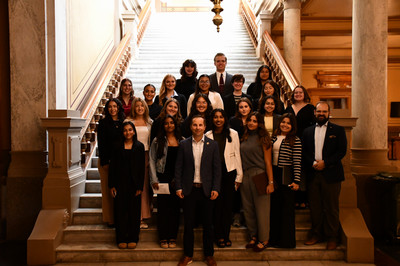 Students standing on the steps at the Statehouse