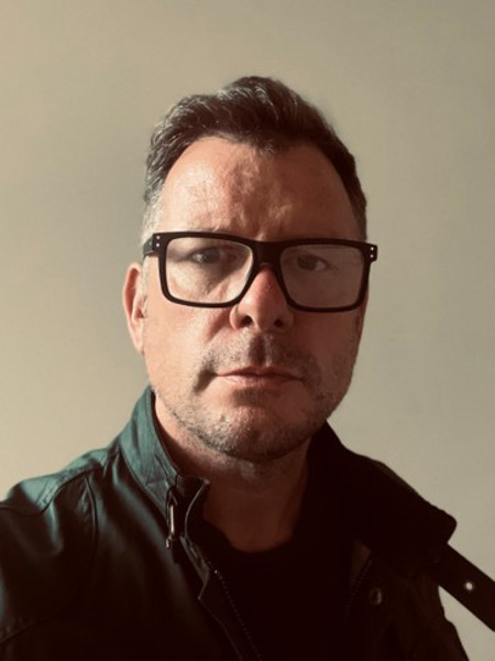 head shot of person looking at camera