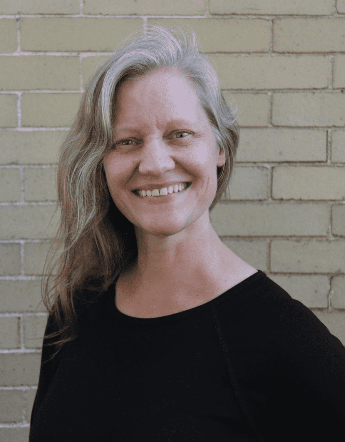A head shot of the alumna guest choreographer Christi Carr.