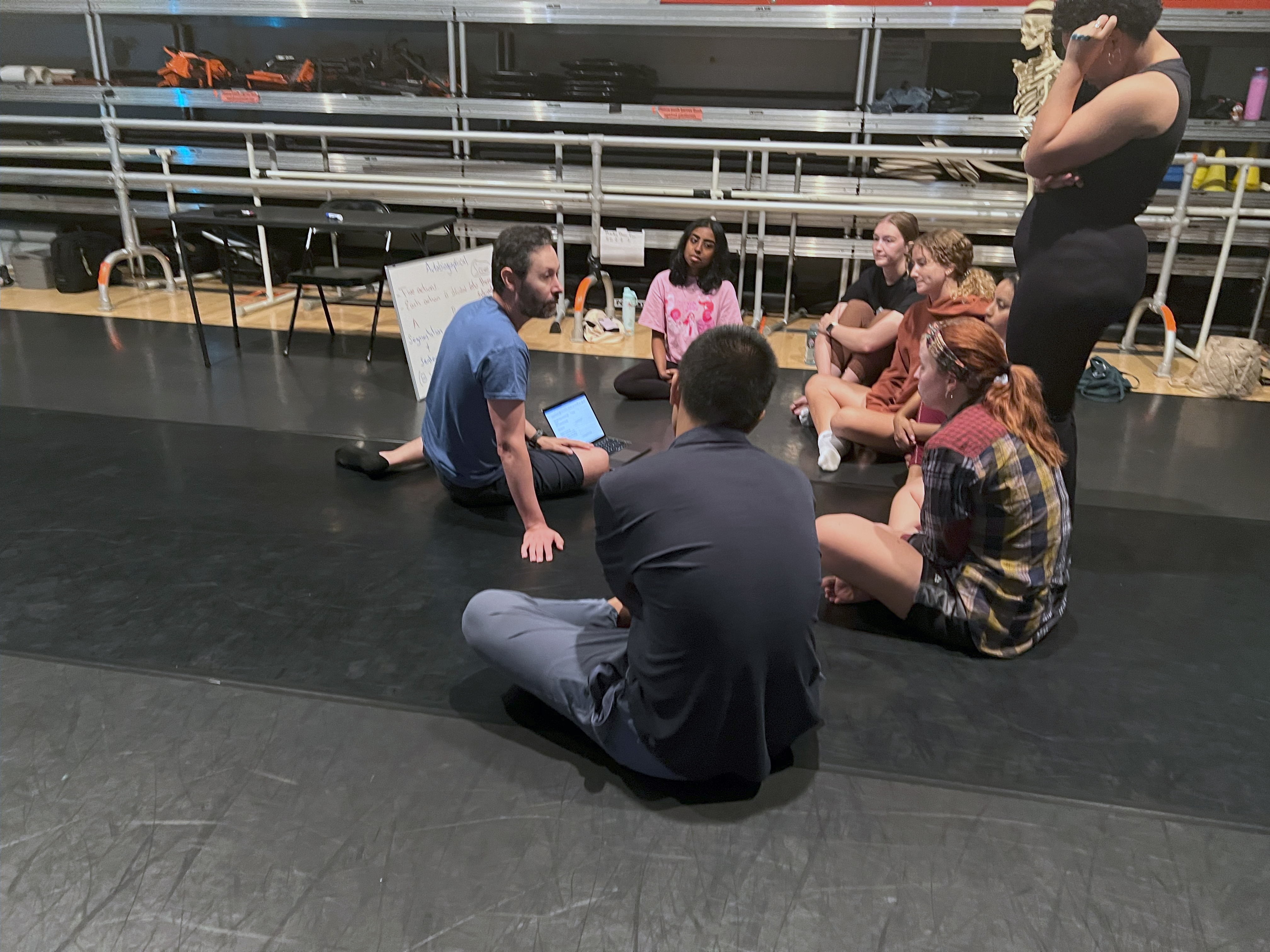 Professor Sierra talks with students about embodiment techniques.