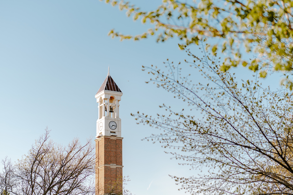 Bell tower with trees surrounding it