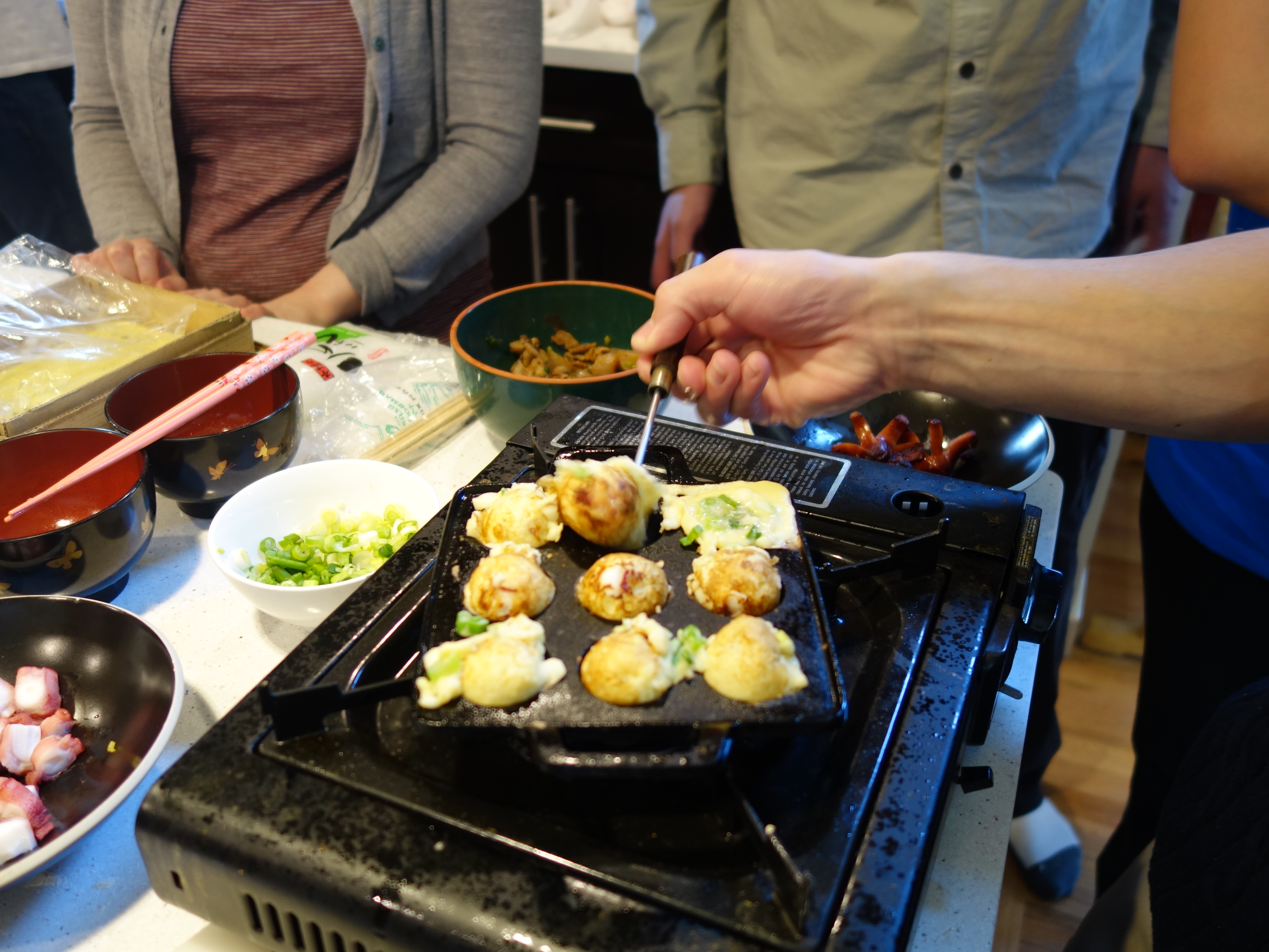 Students Making Takoyaki in Cooking Lab 