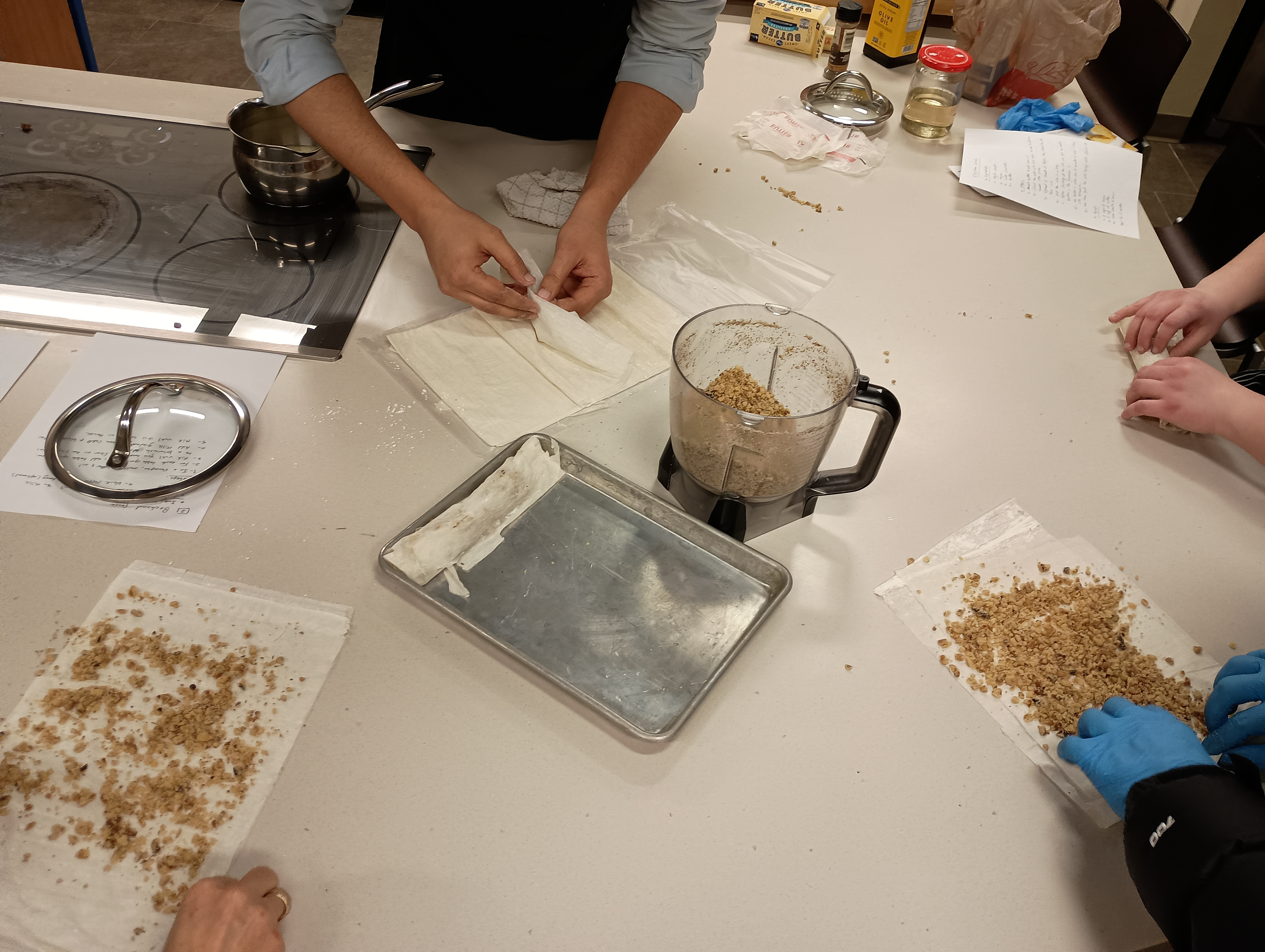 Students Preparing a Food Mixture on Parchment Paper During a Cooking Class