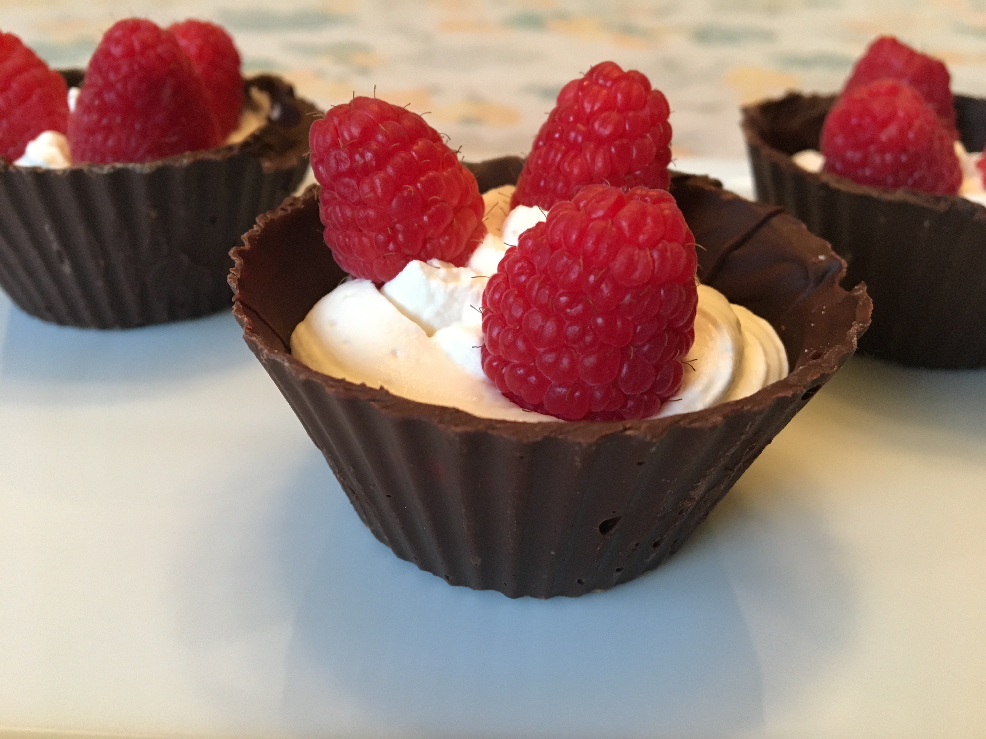 Mini Chocolate Cups with Cream and Fresh Raspberries