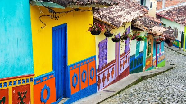 Cobblestone street in Guatape, Colombia with colorful houses