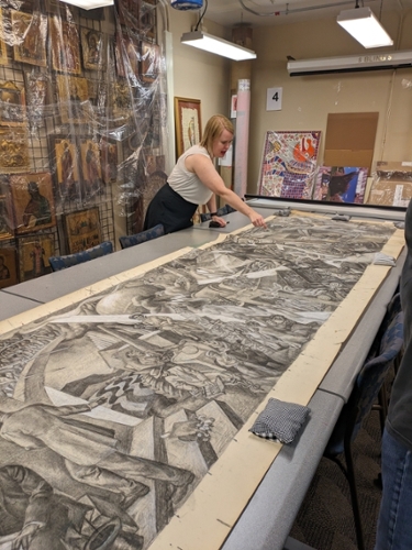 Luce Curator Kirstin Gotway points out where Savage covered up sections and changed details in his original sketch. College of Liberal Arts, 2023.