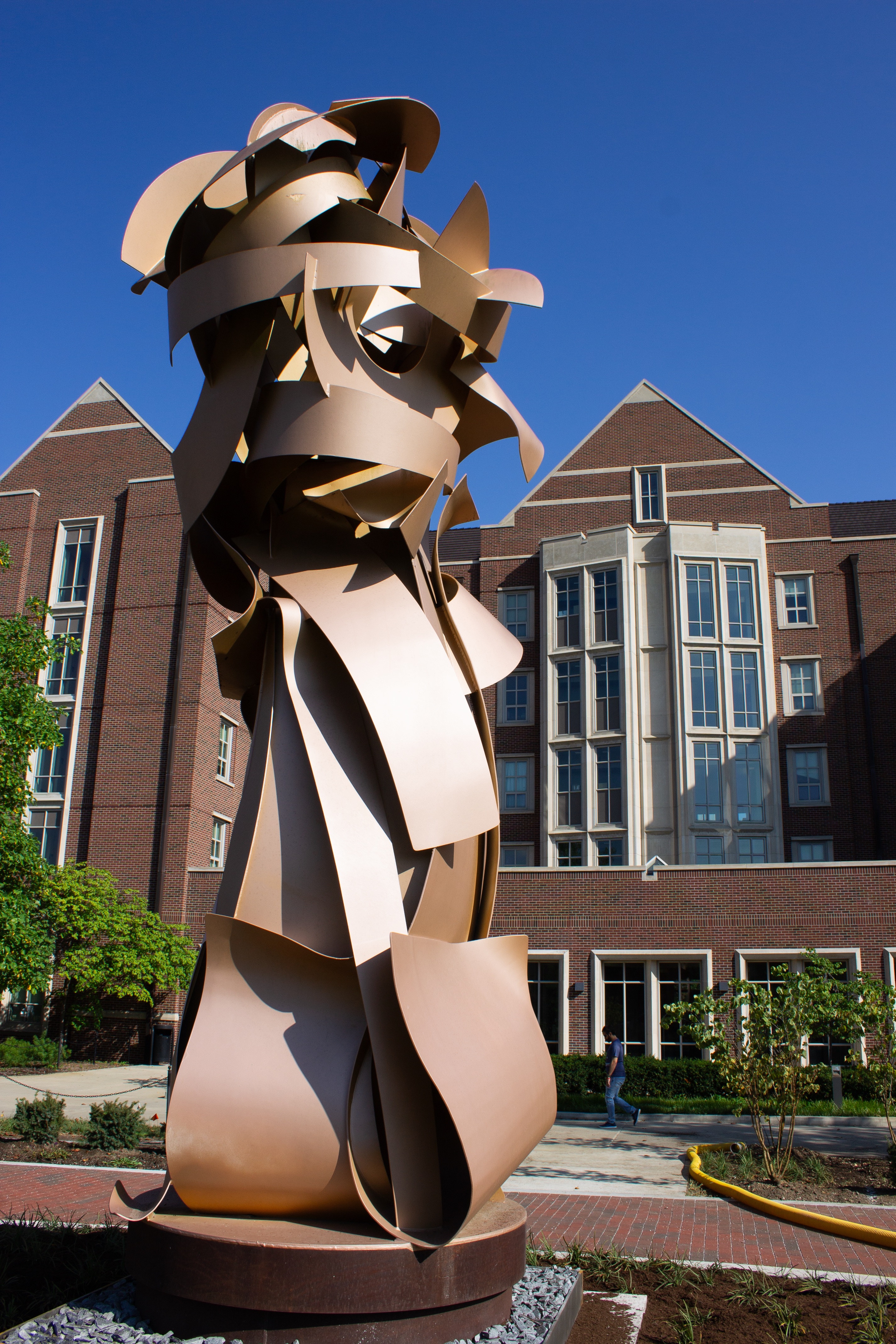 Albert Paley's 2013 Envious Composure metal sculpture on display in front of the First Street Towers on Mitch Daniels Boulevard. College of Liberal Arts, 2023.