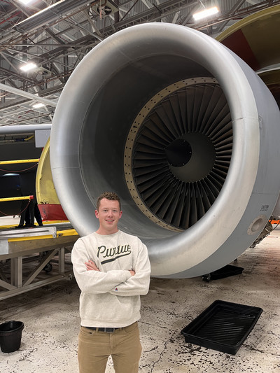 Escorted around an aircraft under maintenance from DC, Barden and cohort explore the inner workings of this engine.