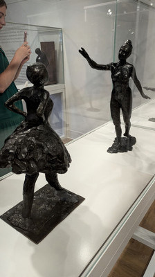 Two of Degas' dancers greeting each other, each fine examples of the artist's process in working out poses for his paintings. 