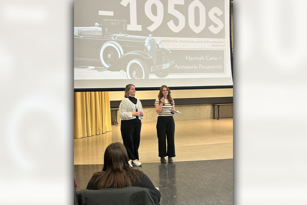 Teaching assistants Hannah Cano and Annmarie Pesavento lead a history lecture