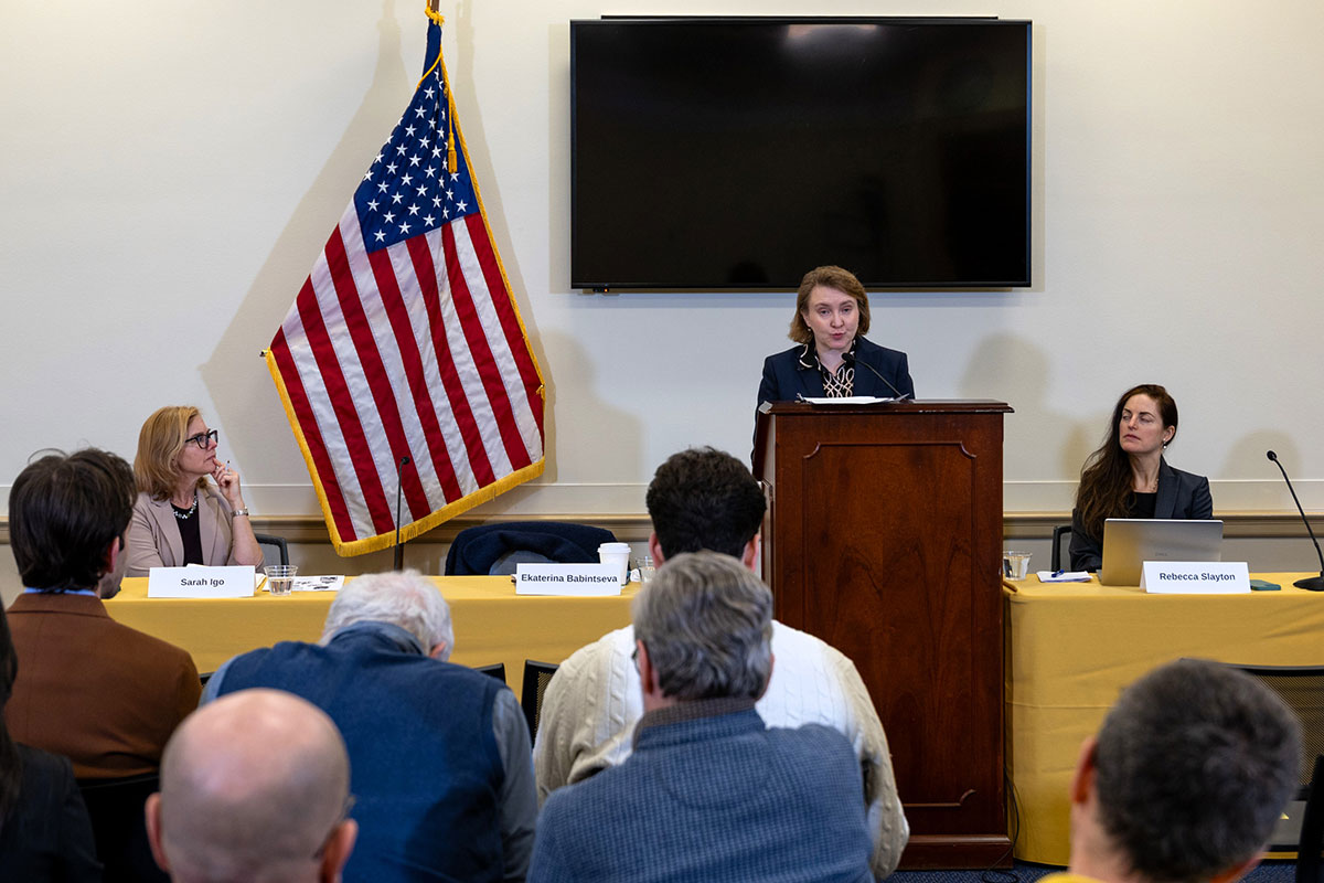 Ekaterina Babintseva presents from podium in a congressional briefing