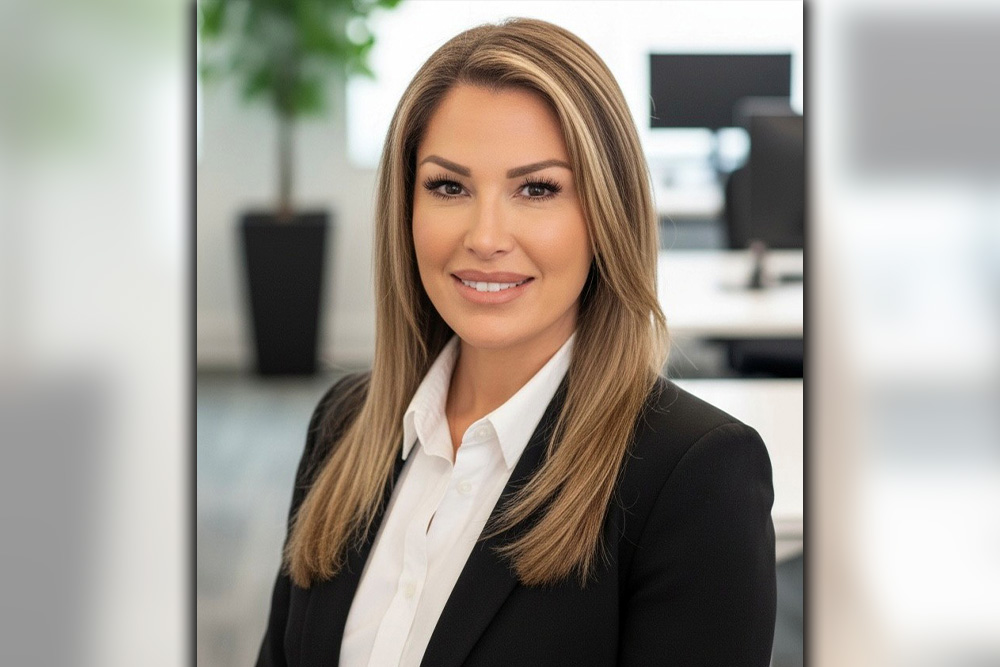 Heidi Foster posing in a blazer for a headshot.