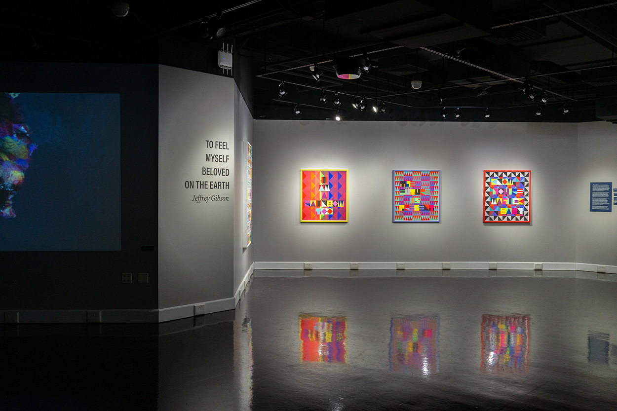 Colorful patchwork art hanging on the walls of the Ringel Gallery