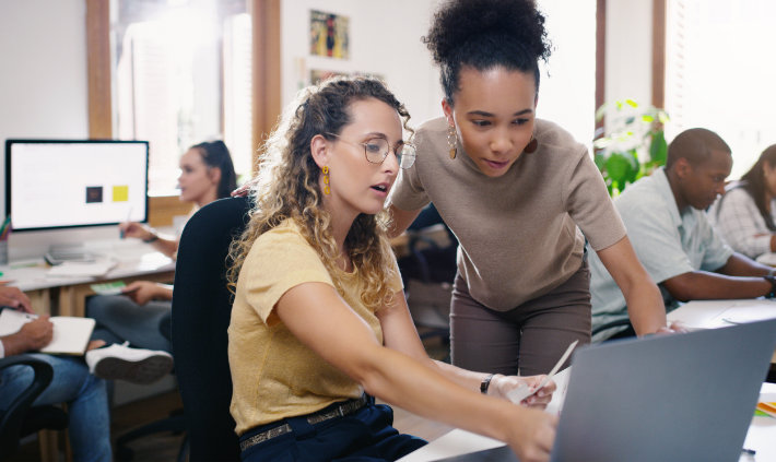 Two students looking at a a computer