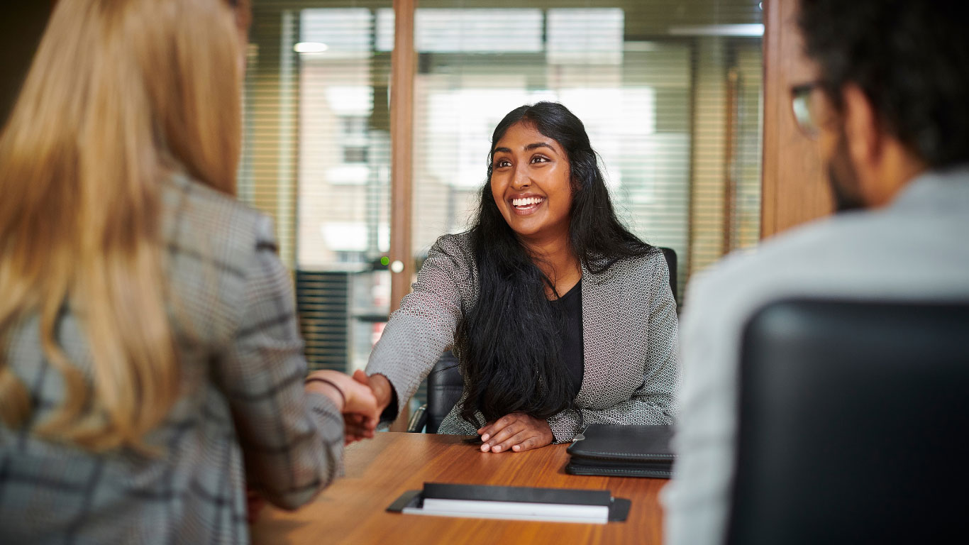 A student talking with potential employers